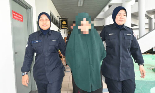 Wanita didakwa simbah anak lelaki dengan air panas