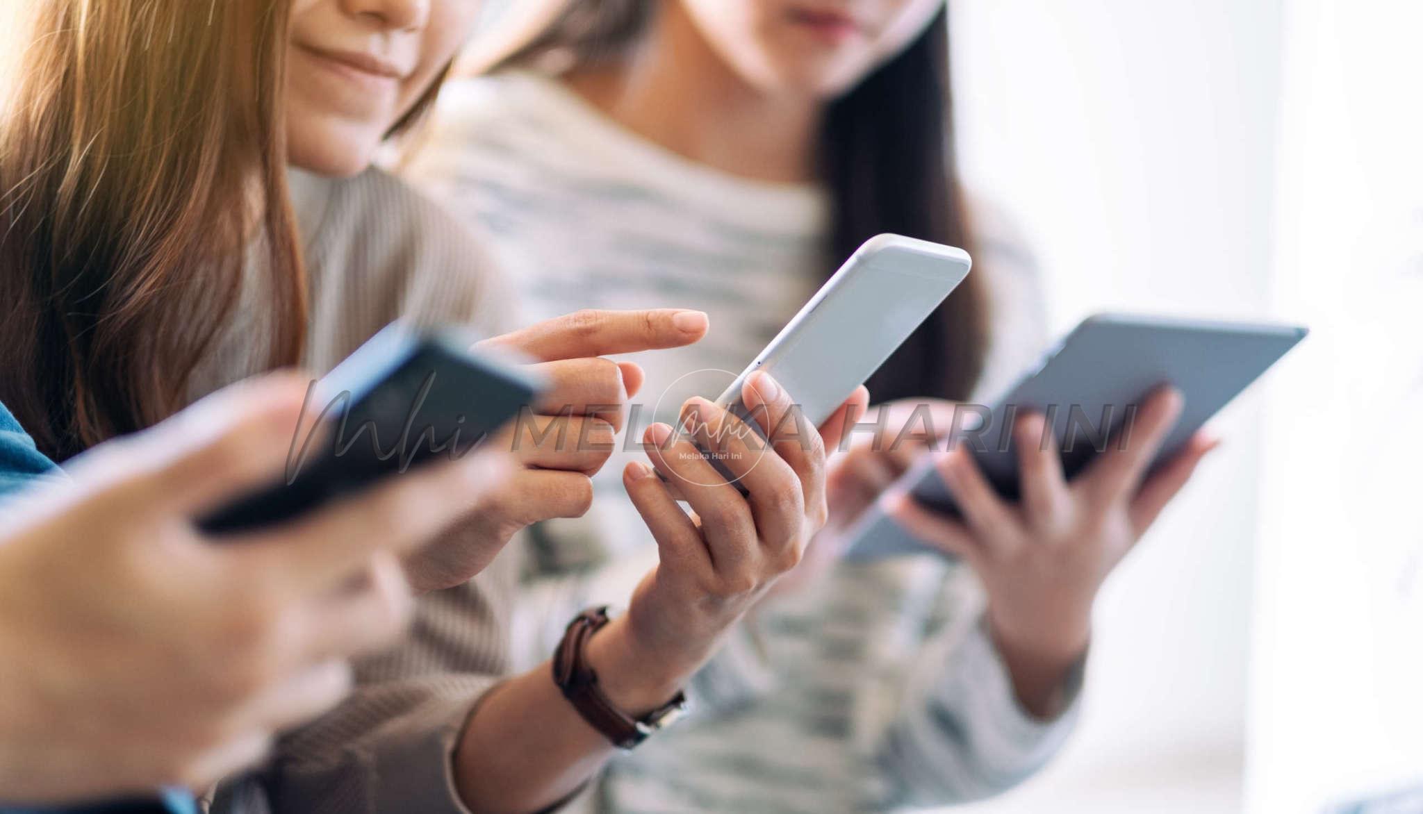 Group Of People Using And Looking At Mobile Phone And Tablet Pc